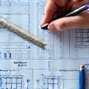 Image representing the design and estimation phase, showing architectural drawings, blueprints, or digital building plans being reviewed.
