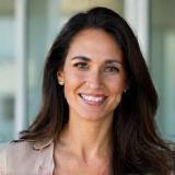Headshot of satisfied client Maria Rodriguez, smiling warmly.